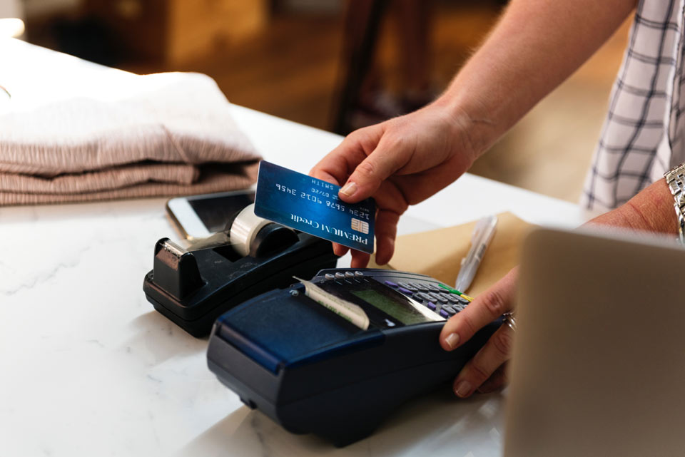 A cash register and credit card