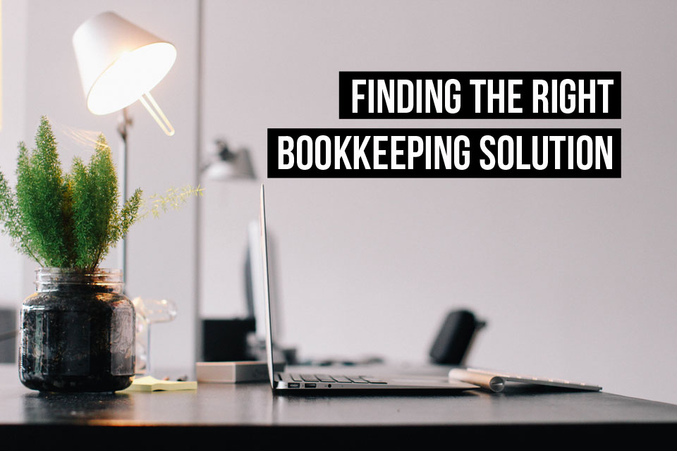 There are many options for bookkeeping today. Including those you can manage from a computer like this one on a desk in a home.