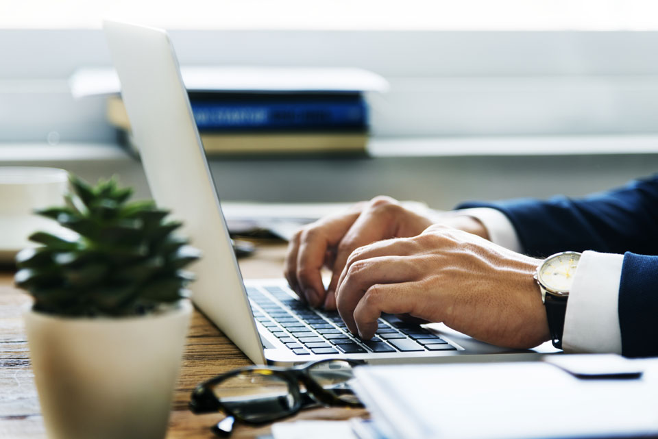 Even an accountant like this one working on his computer can easily collaborate on your account with the right software