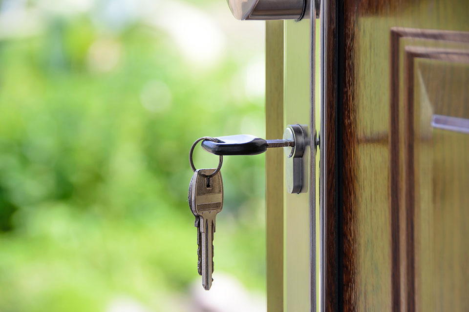 Close up image of house keys in door. Use the Help-to-Buy ISA to save for your first home