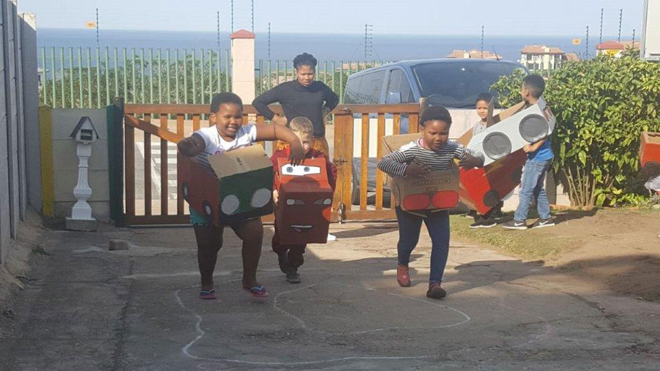 Kids of Moss Kiddos racing with homemade cars