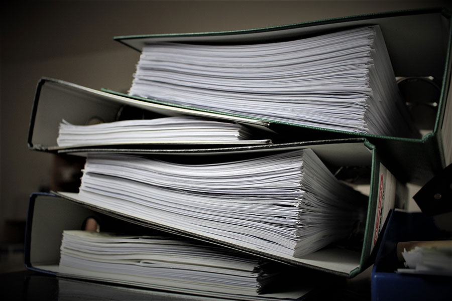 binders with paper in - digital record keeping for Making Tax Digital