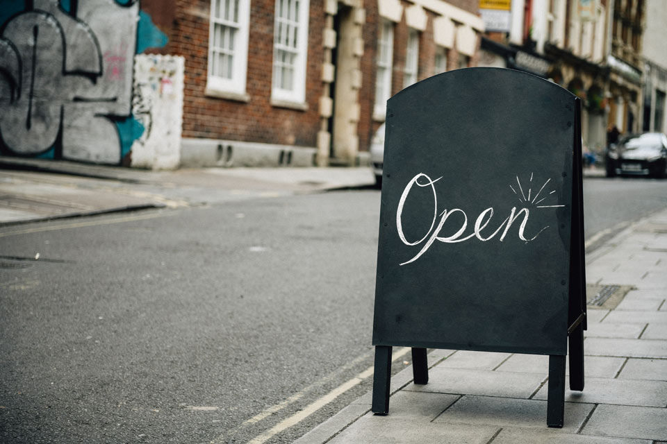 A shop sign showing a newly opened small business