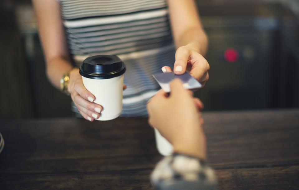 Accepting credit card payments on the spot for a coffee to go with a card reader